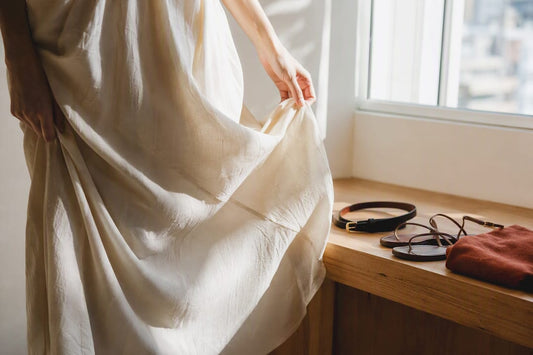 Midi dress hem with understated styling accessories