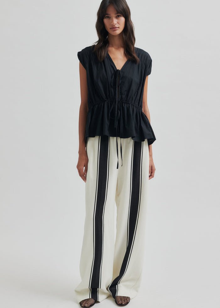 Lie Trousers in White from SECOND FEMALE at Edito boutique